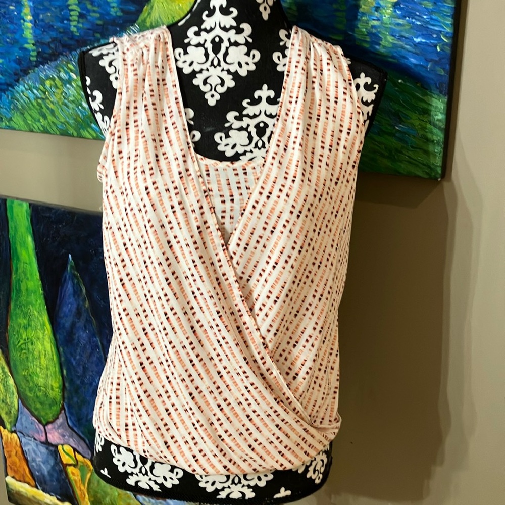 WHBM sleeveless blouse with V neckline and crossover front with material under